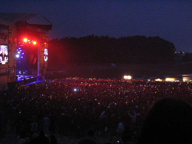 Ozzy Osbourne playing at Download Festival with the crowd waving their lighters